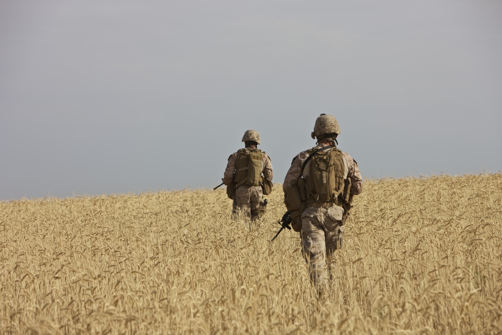 US Marines patrol a wadi near Kunduz Afghanistan Canvas Art - Terry MooreStocktrek Images (35 x 24)
