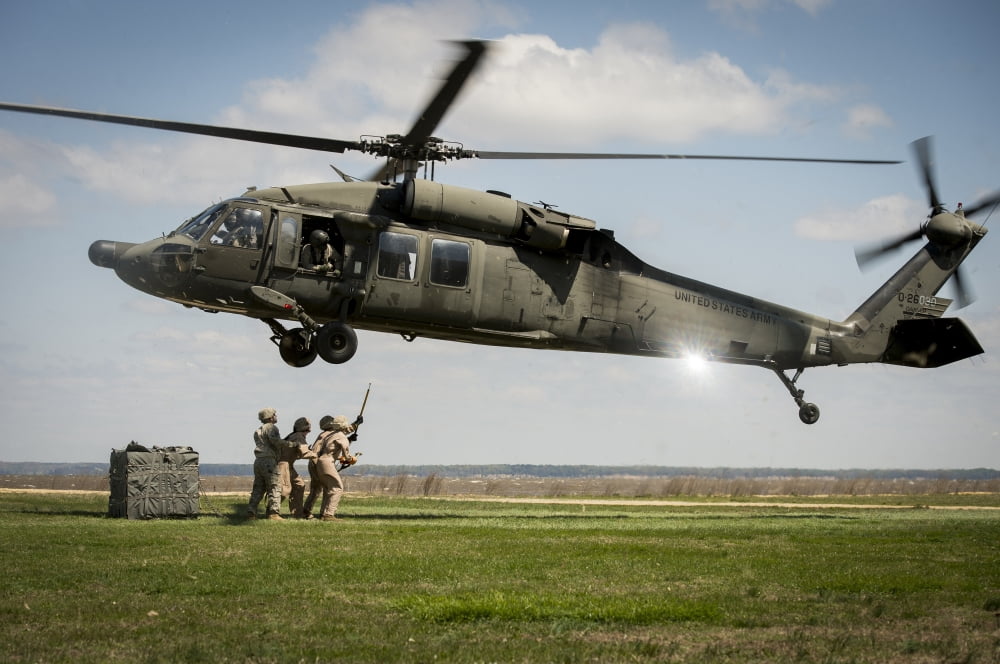 US Marines prepare to attach cargo under a UH-60 Black Hawk Canvas Art - Stocktrek Images (34 x 23)