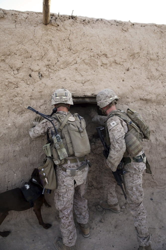 US Marines push down a wall in an empty compound Canvas Art - Stocktrek Images (23 x 35)