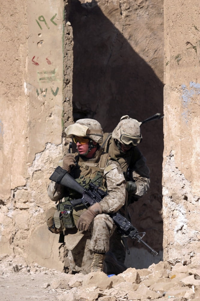 US Marines taking cover in an abandoned house during a patrol through Haditha Iraq Canvas Art - Stocktrek Images (23 x 34)