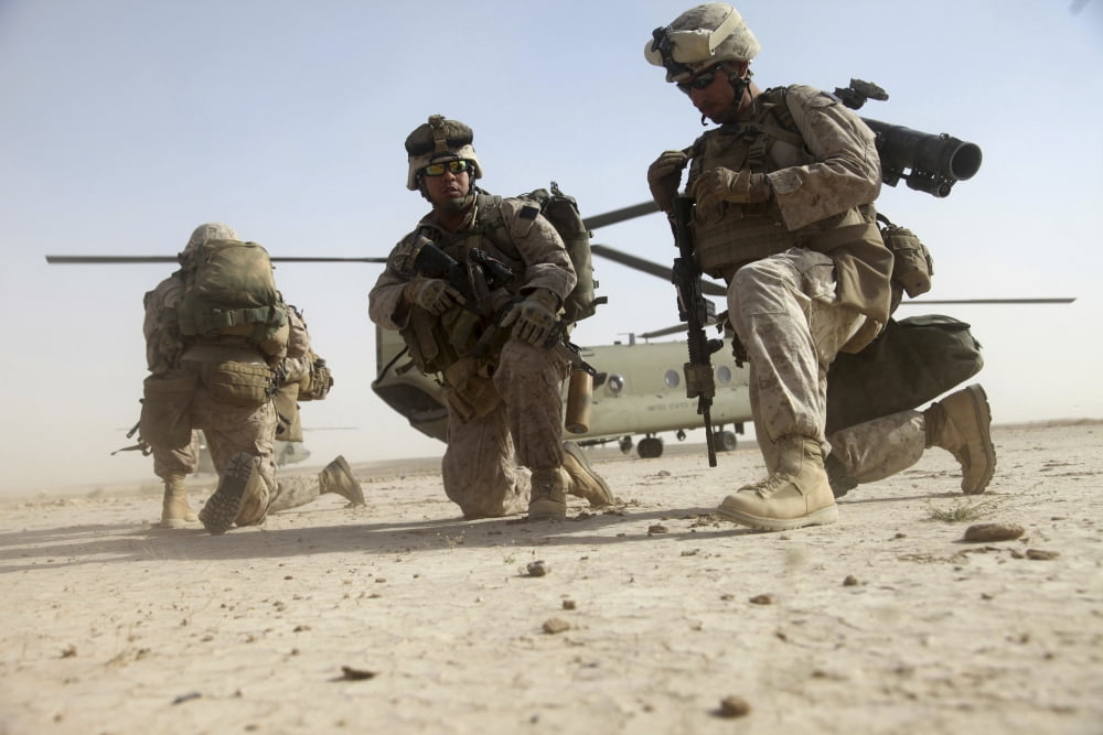 US Marines unloading from a helicopter outside of Camp Bastion Afghanistan Canvas Art - Stocktrek Images (34 x 23)