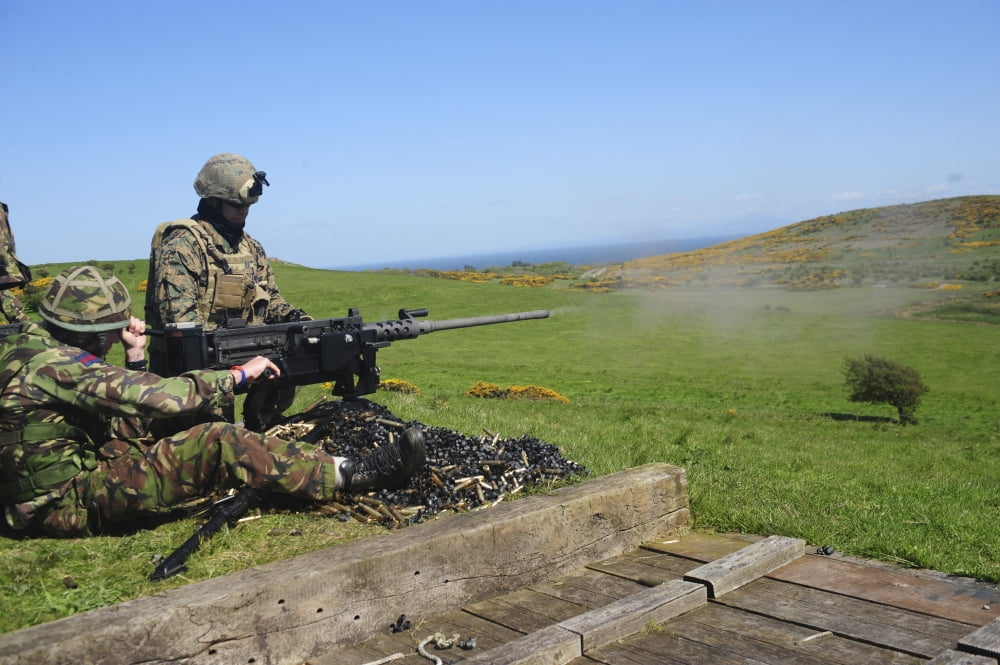 US Marines work with the British Army on firing a 50 caliber heavy machine gun Canvas Art - Andrew ChittockStocktrek Images (17 x 12)