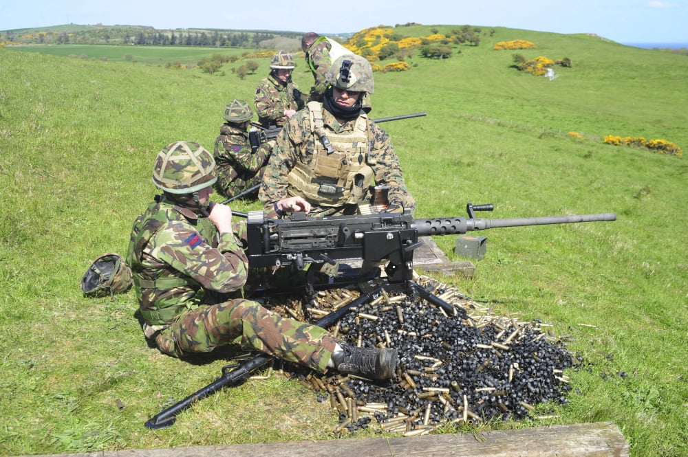 US Marines work with the British Army on firing a 50 caliber heavy machine gun Canvas Art - Andrew ChittockStocktrek Images (34 x 23)