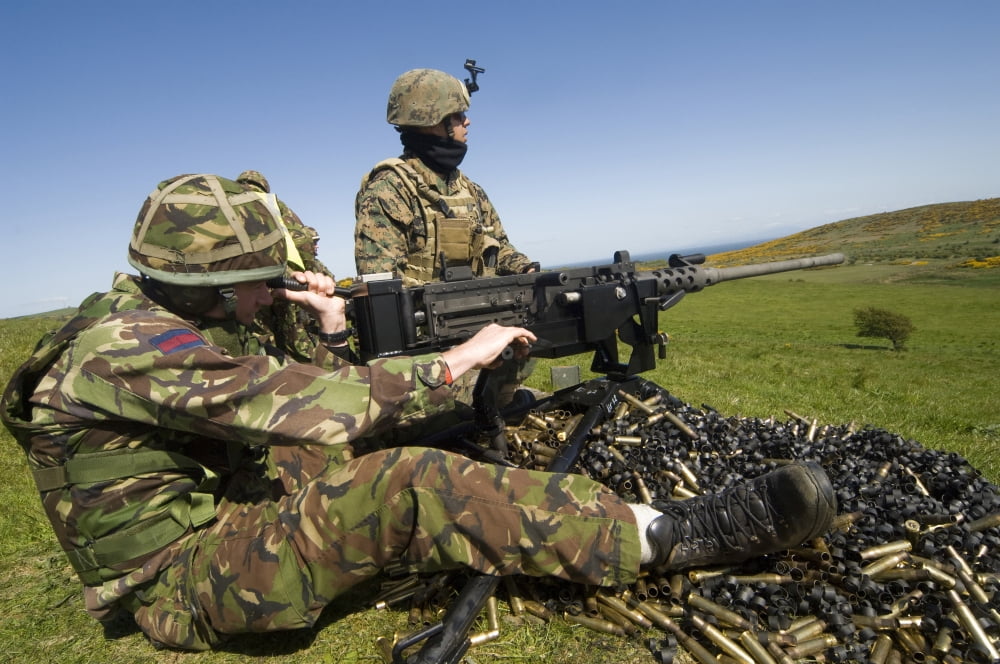 US Marines work with the British Army on firing a 50 caliber heavy machine gun Canvas Art - Andrew ChittockStocktrek Images (34 x 23)