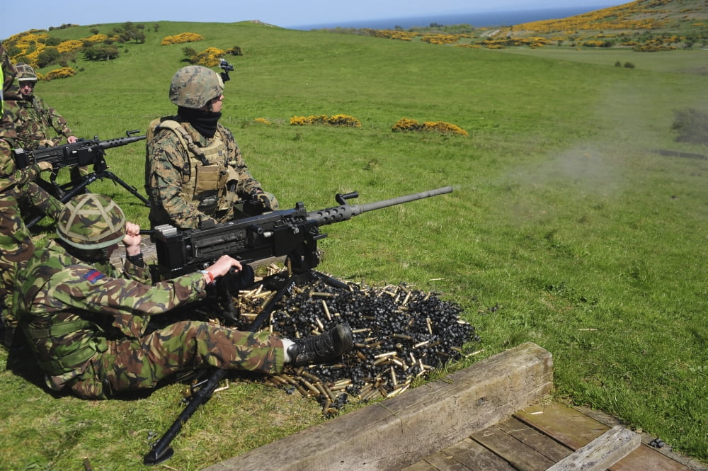 US Marines work with the British Army on firing a 50 caliber heavy machine gun Canvas Art - Andrew ChittockStocktrek Images (34 x 23)