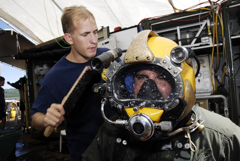 US Navy Diver performs a leak check on a Navy Diver Canvas Art - Stocktrek Images (35 x 23)