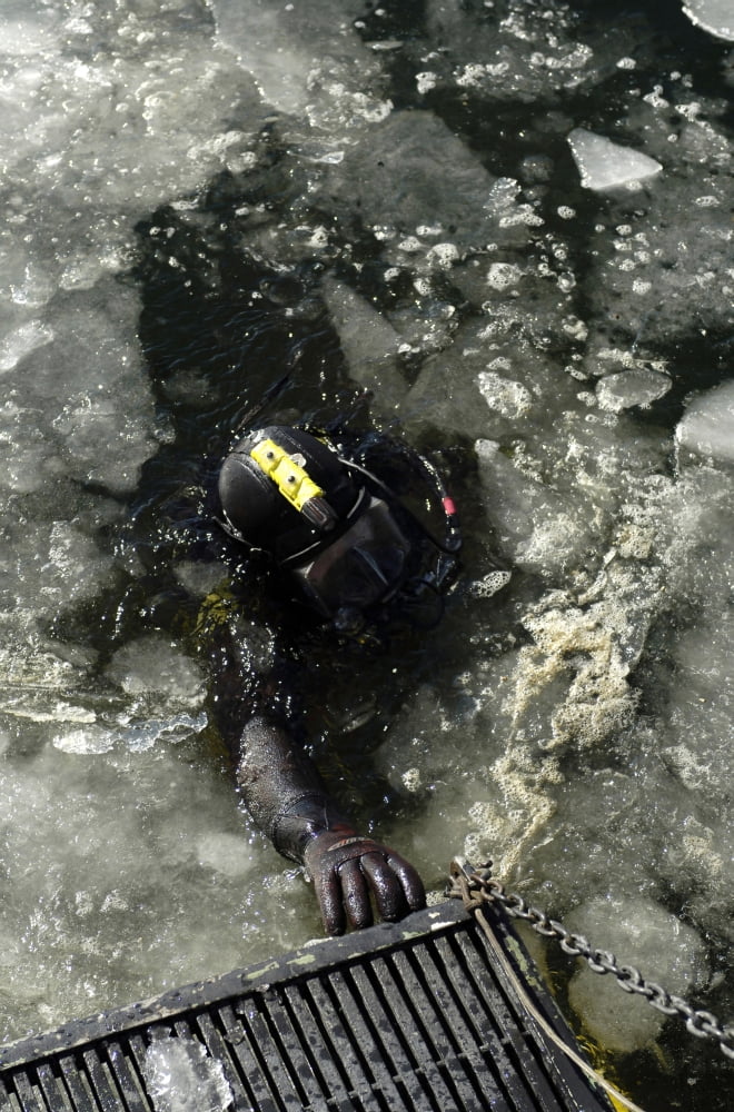 US Navy Diver swims back to the dive training boat after completing a training mission on the Thames River Canvas Art - Stocktrek Images (23 x 34)