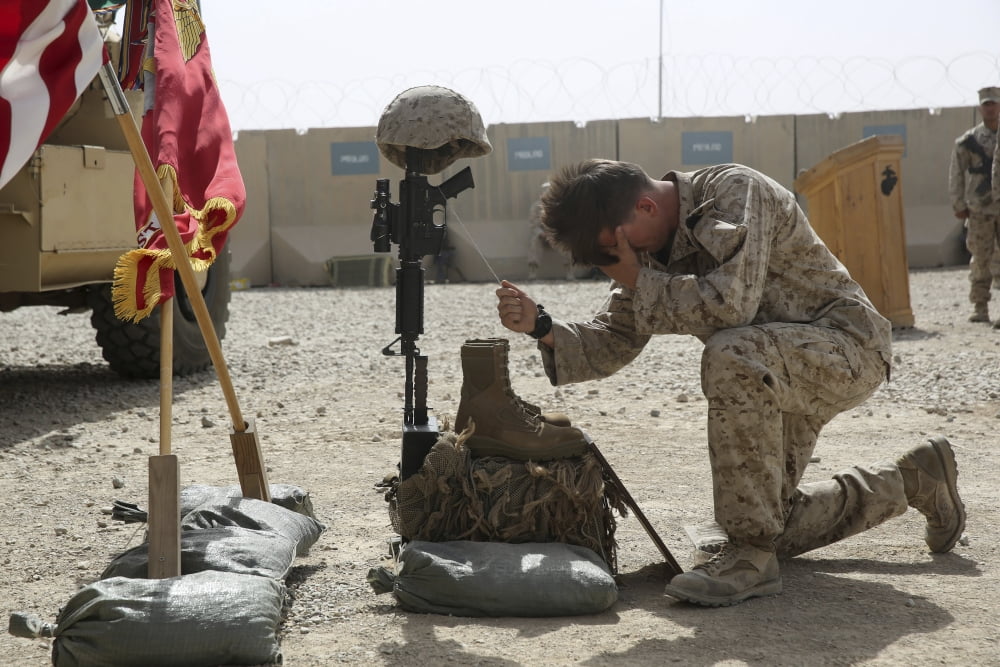 US Navy Hospital Corpsman attends a memorial ceremony at Camp Leatherneck Canvas Art - Stocktrek Images (34 x 23)