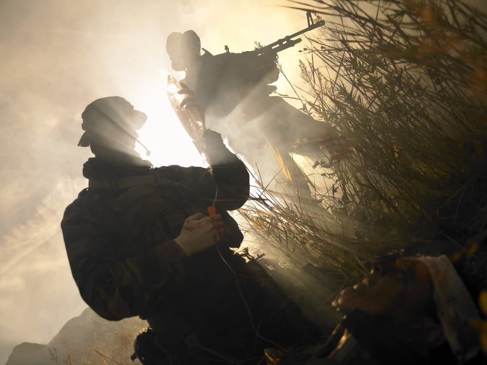 US Navy SEALs give first aid to a wounded soldier Canvas Art - Tom WeberStocktrek Images (33 x 25)