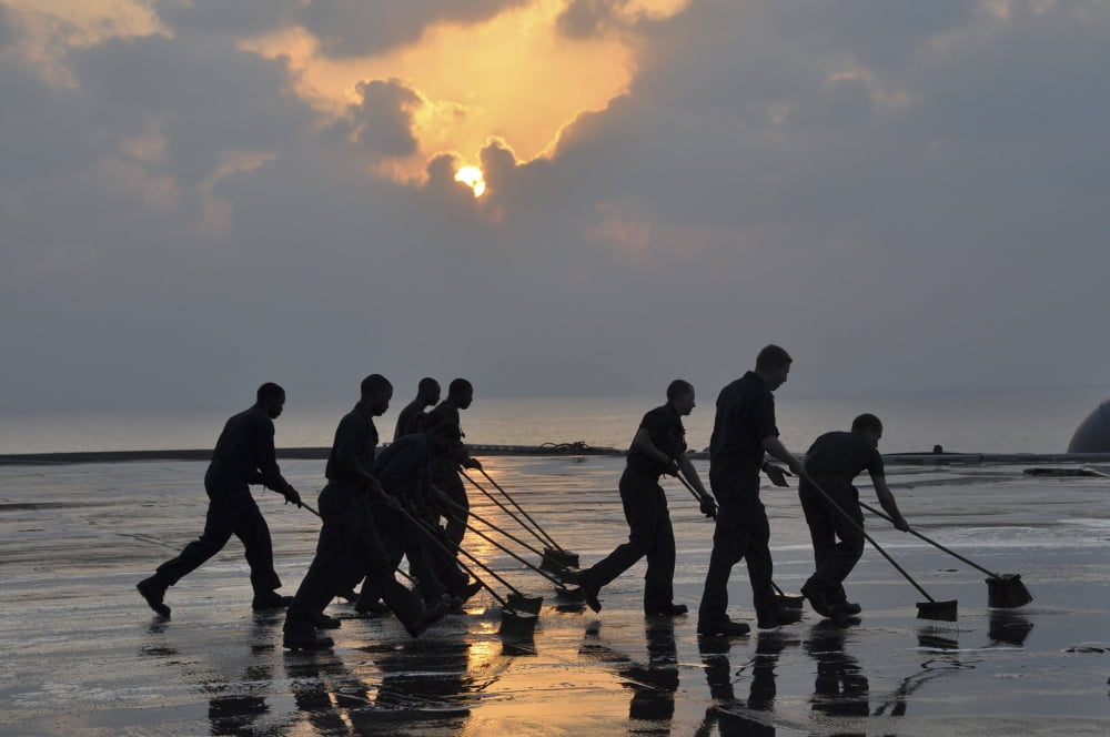 US Navy sailors wash down the flight deck of the aircraft carrier USS Nimitz Canvas Art - Stocktrek Images (35 x 23)