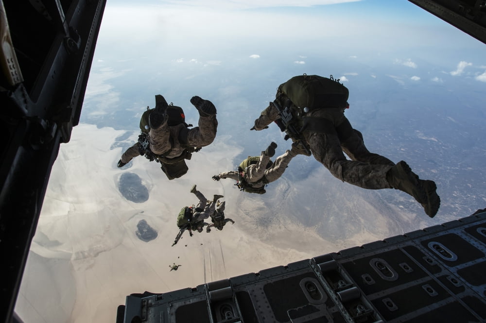 US Pararescuemen and US Marines jump from a HC-130 over Djibouti Canvas Art - Stocktrek Images (34 x 23)