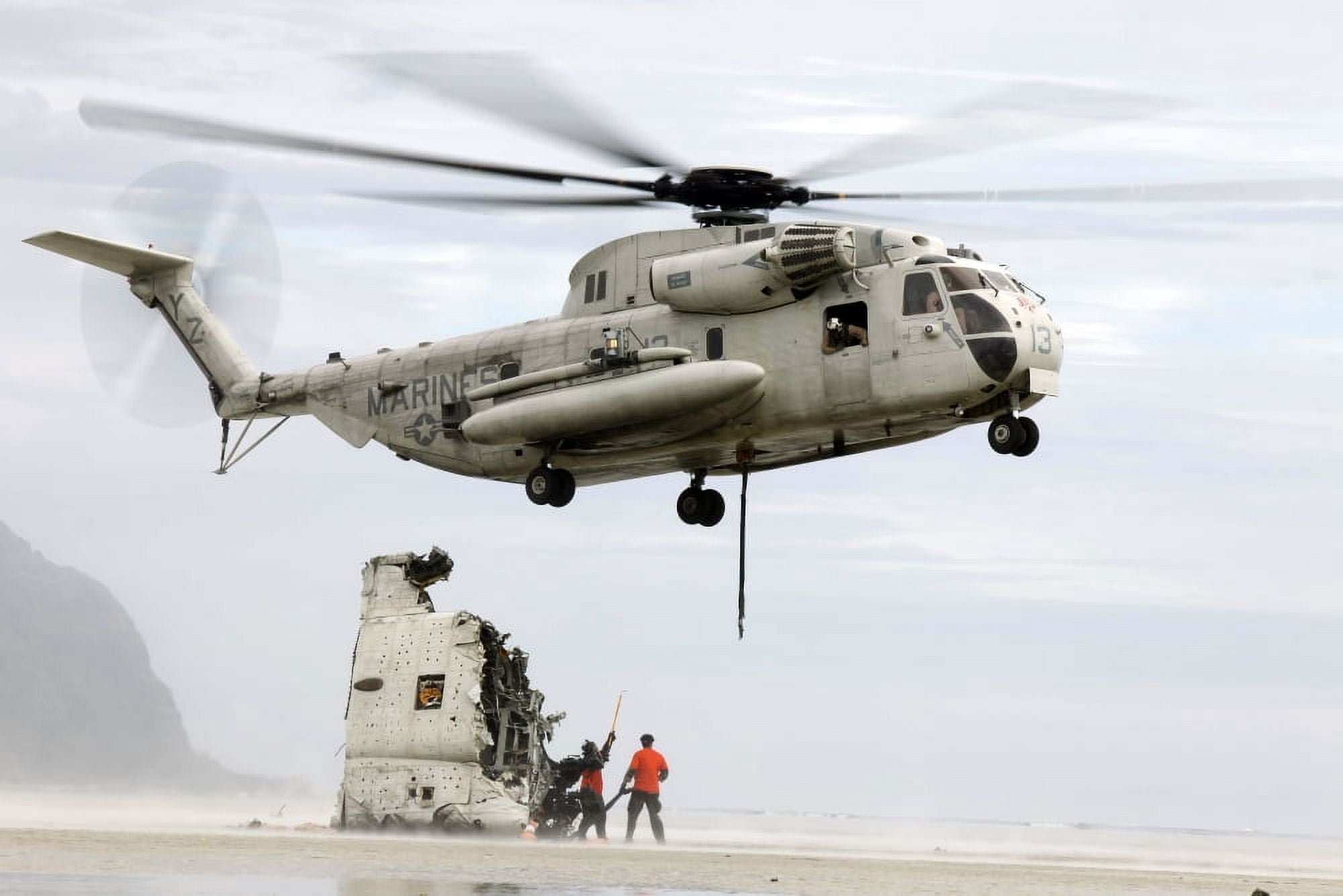 US Sailors assist a CH-53D Sea Stallion helicopter in removing wreckage Canvas Art - Stocktrek Images (35 x 23)