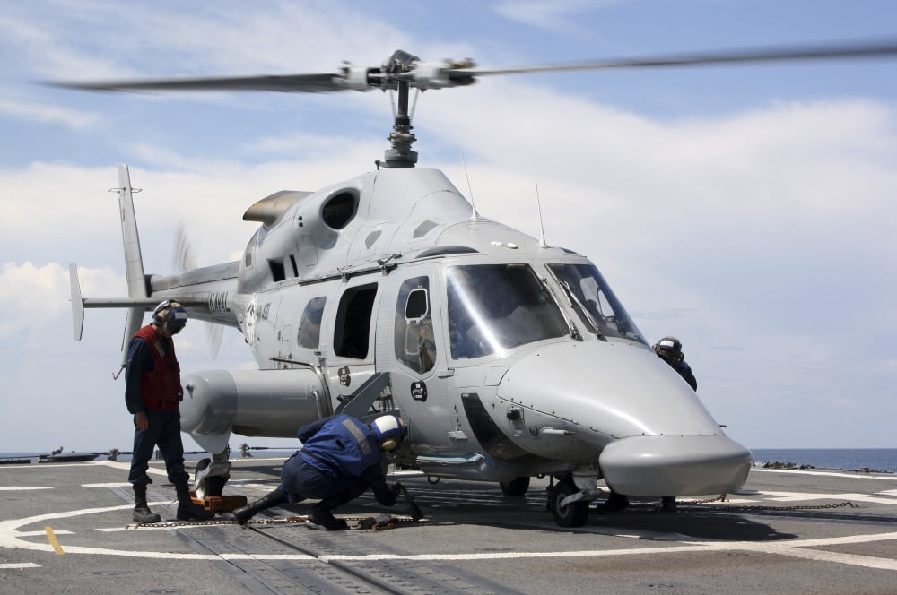 US Sailors chock and chain an Ecuadorian Navy Bell 230 helicopter Canvas Art - Stocktrek Images (35 x 23)
