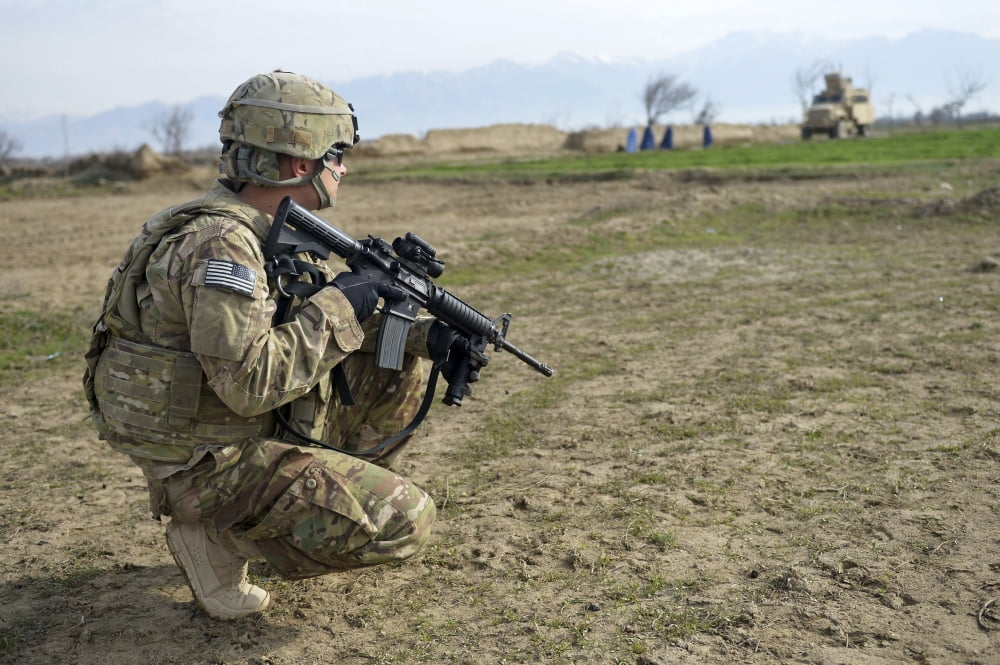 US Soldier patrols a village in Afghanistan Canvas Art - Stocktrek Images (35 x 23)