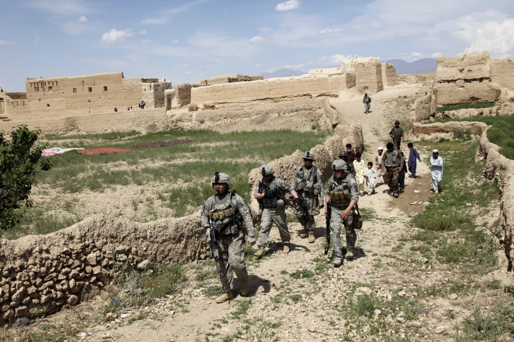 US Soldiers conduct a dismounted patrol to a mosque in the village of Bidak in Logar Afghanistan Canvas Art - Stocktrek Images (34 x 23)