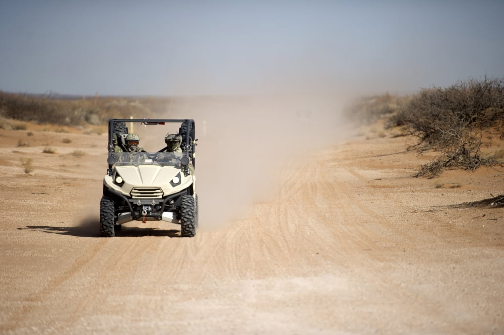 US Soldiers drive a LTATV down a dirt road Canvas Art - Stocktrek Images (34 x 23)