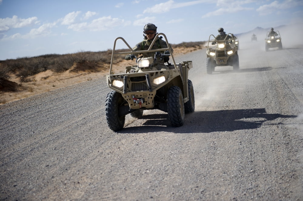 US Soldiers perform maneuvers on a gravel road with an LTATV Canvas Art - Stocktrek Images (34 x 23)