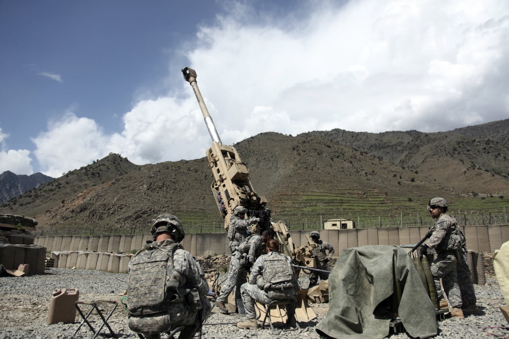 US Soldiers prepare for their next fire mission in Afghanistan Canvas Art - Stocktrek Images (34 x 23)