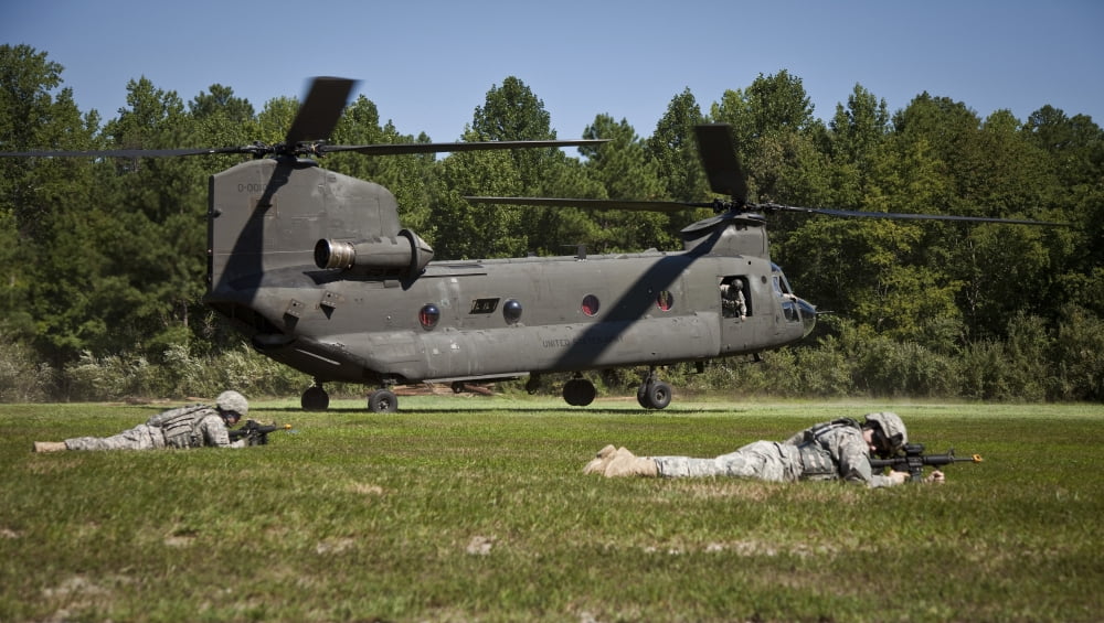 US Soldiers provide security for a CH-47 Chinook helicopter Canvas Art - Stocktrek Images (38 x 21)