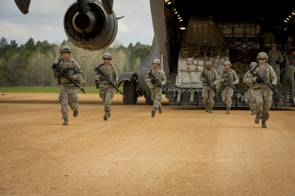 US aeromedical evacuation Airmen exit a C-17 Globemaster III Canvas Art - Stocktrek Images (34 x 23)
