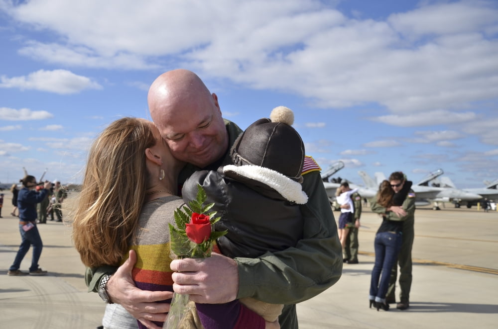 US aviator is greeted by his wife at Naval Air Station Oceana Canvas Art - Stocktrek Images (35 x 23)