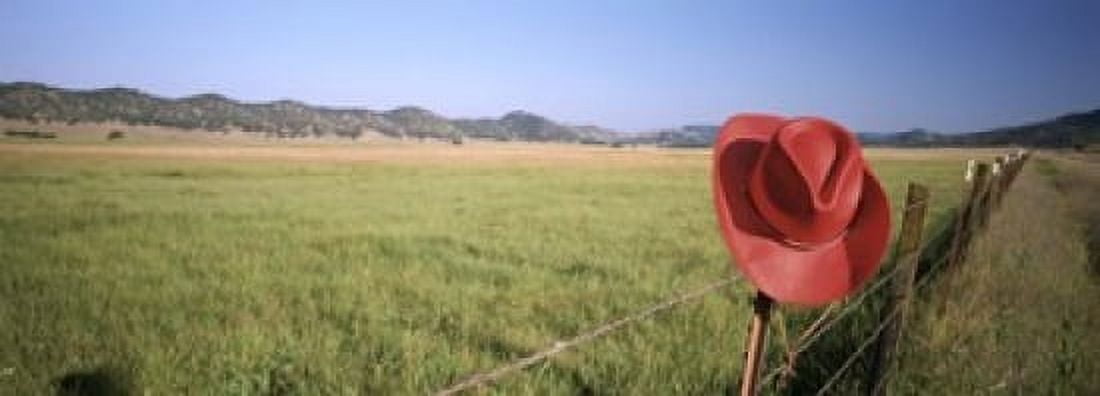 USA California Red cowboy hat hanging on the fence Canvas Art - Panoramic Images (18 x 7)
