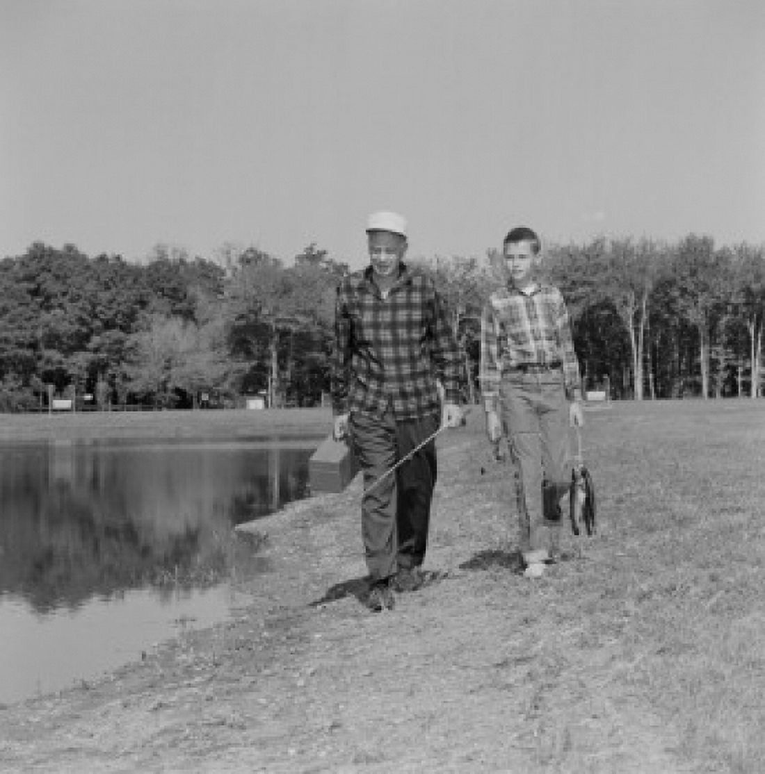USA Father and son with fish and fishing equipment Canvas Art - (24 x 36)