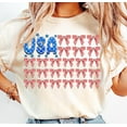 thumbnail image 1 of USA Flag Coquette Bow T-Shirt – Stars and Stripes Bow Tee for 4th of July, Cute American Style, 1 of 5