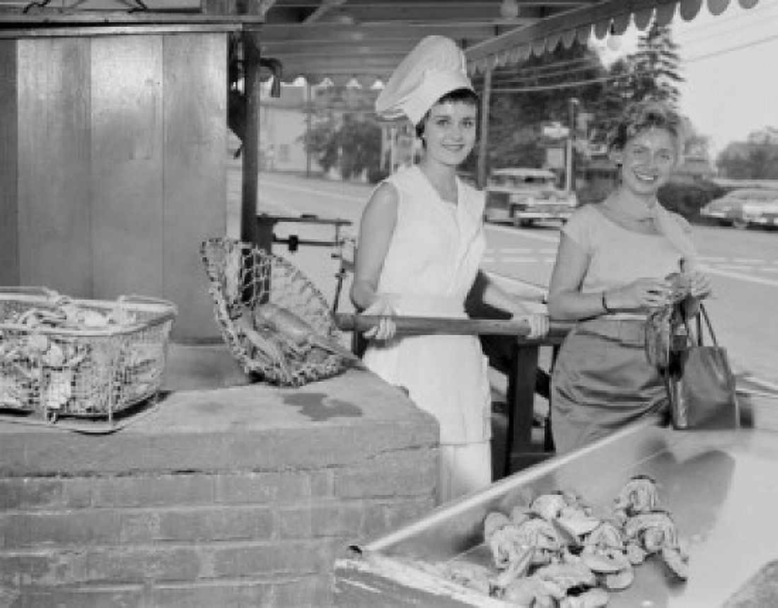 USA Massachusetts Essex Female fishmonger selling Lobsters Canvas Art - (18 x 24)