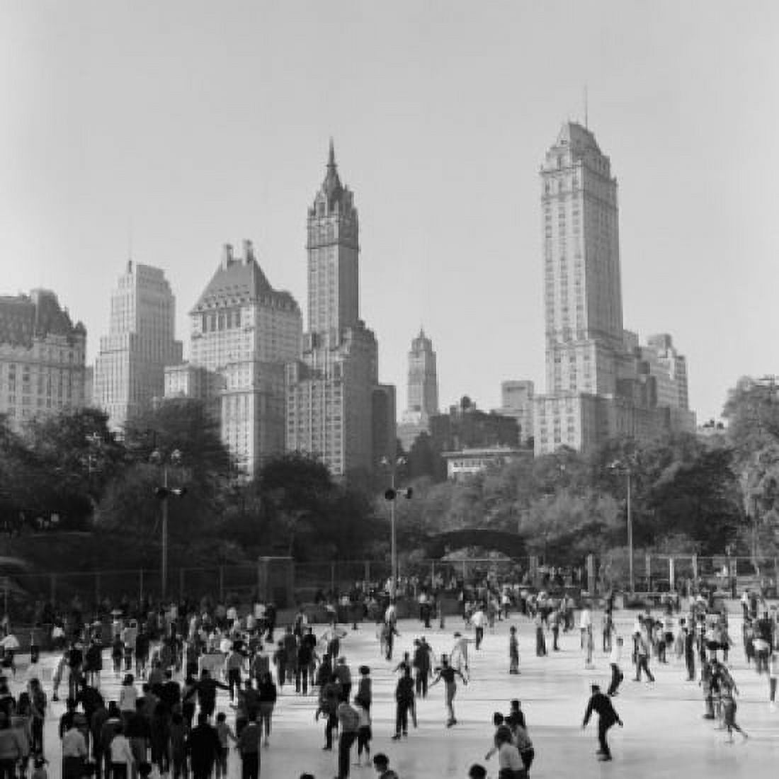 USA New York City Central Park People ice-skating in front of skyline Canvas Art - (24 x 36)