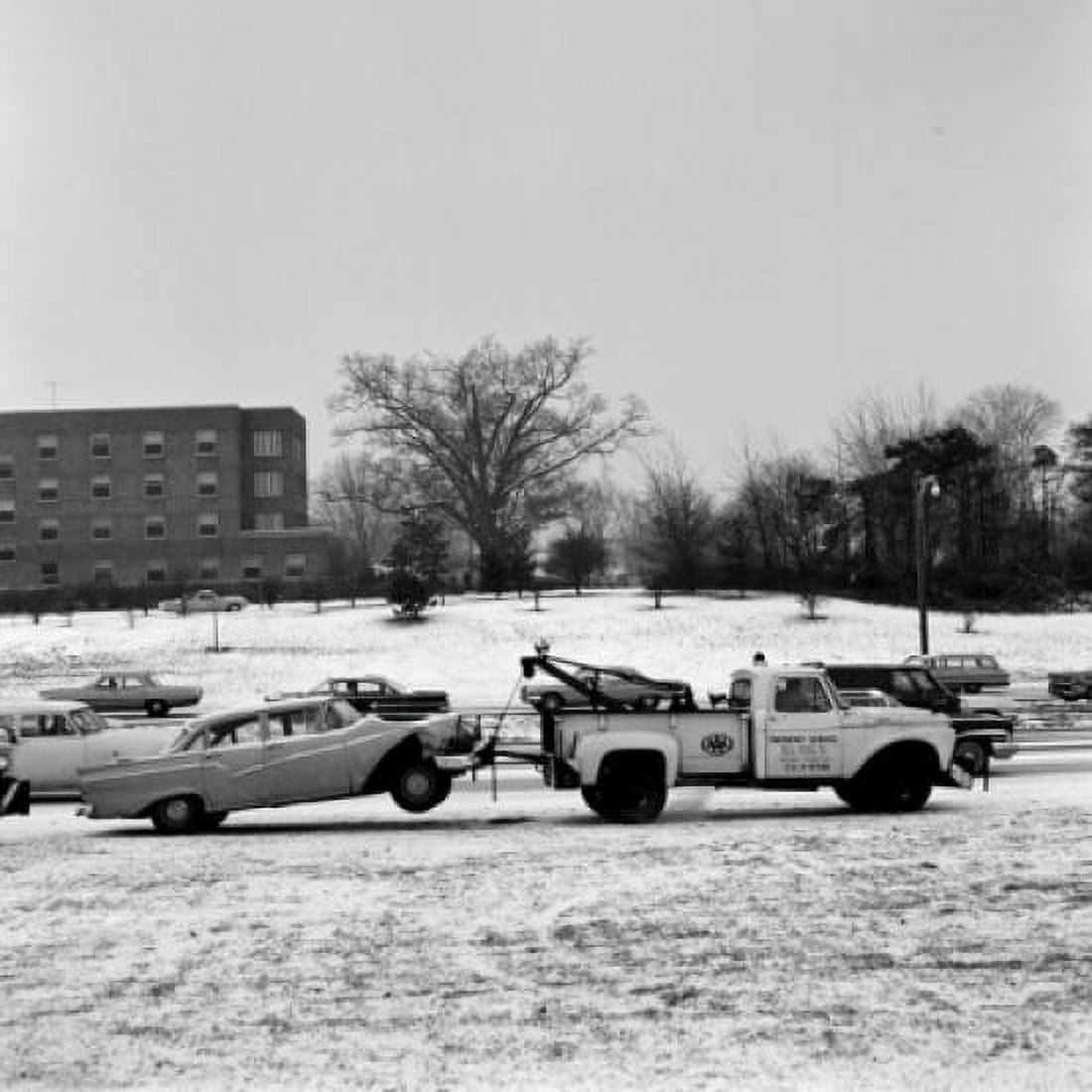 USA New York State Long Island Tow truck pulling wracked car in winter scenery Canvas Art - (24 x 36)