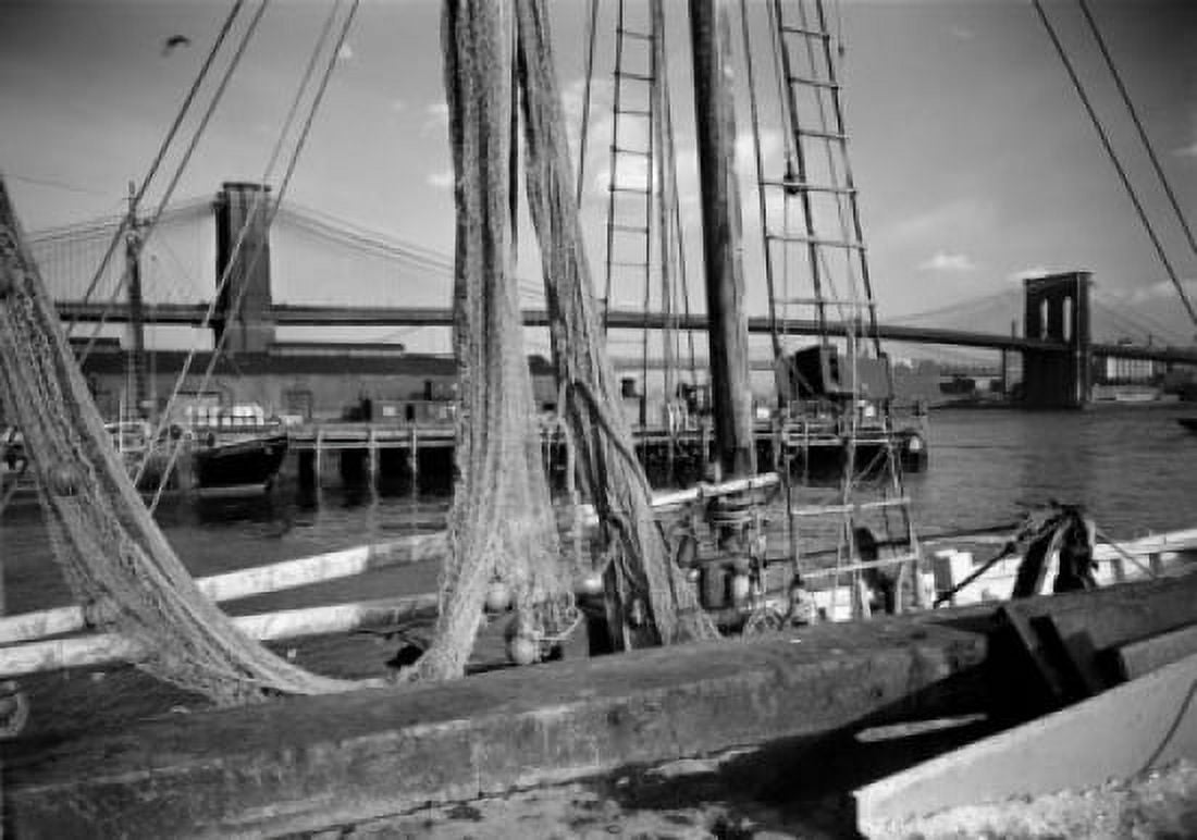 USA New York State New York City Brooklyn Bridge through net of fishing boat at Fulton Market dock Canvas Art - (18 x 24)