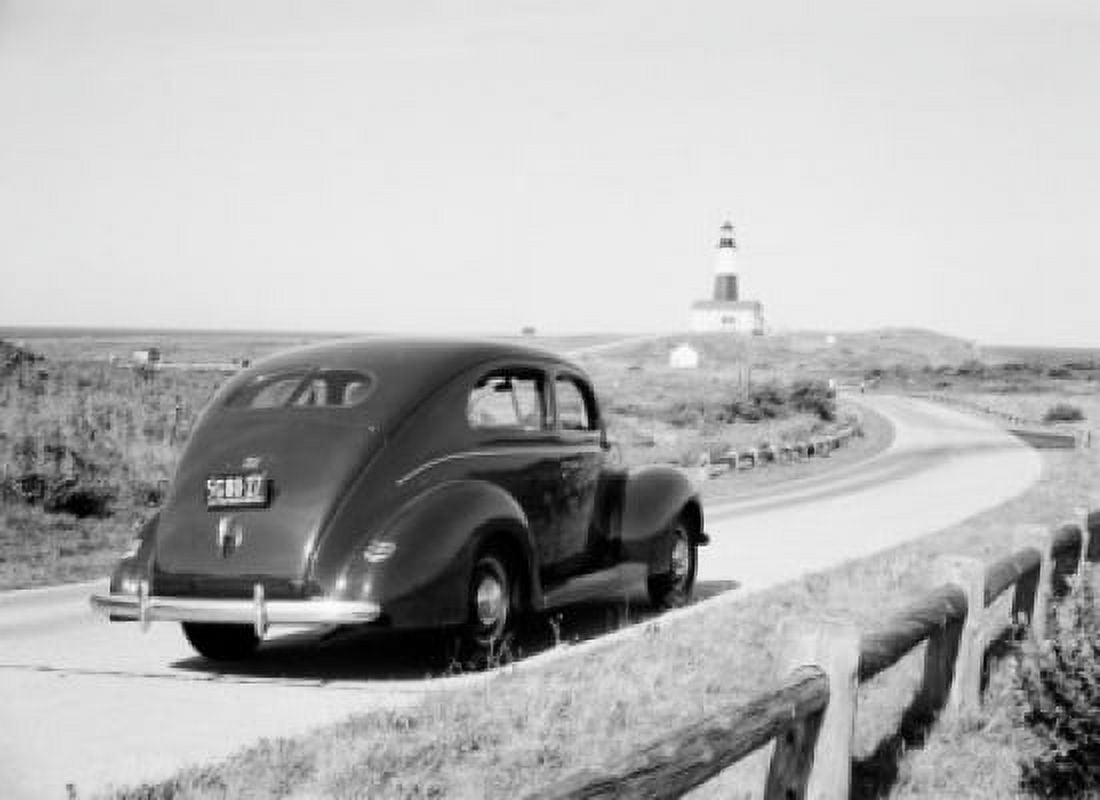 USA New York car approaching Montauk Point Lighthouse Canvas Art - (24 x 36)
