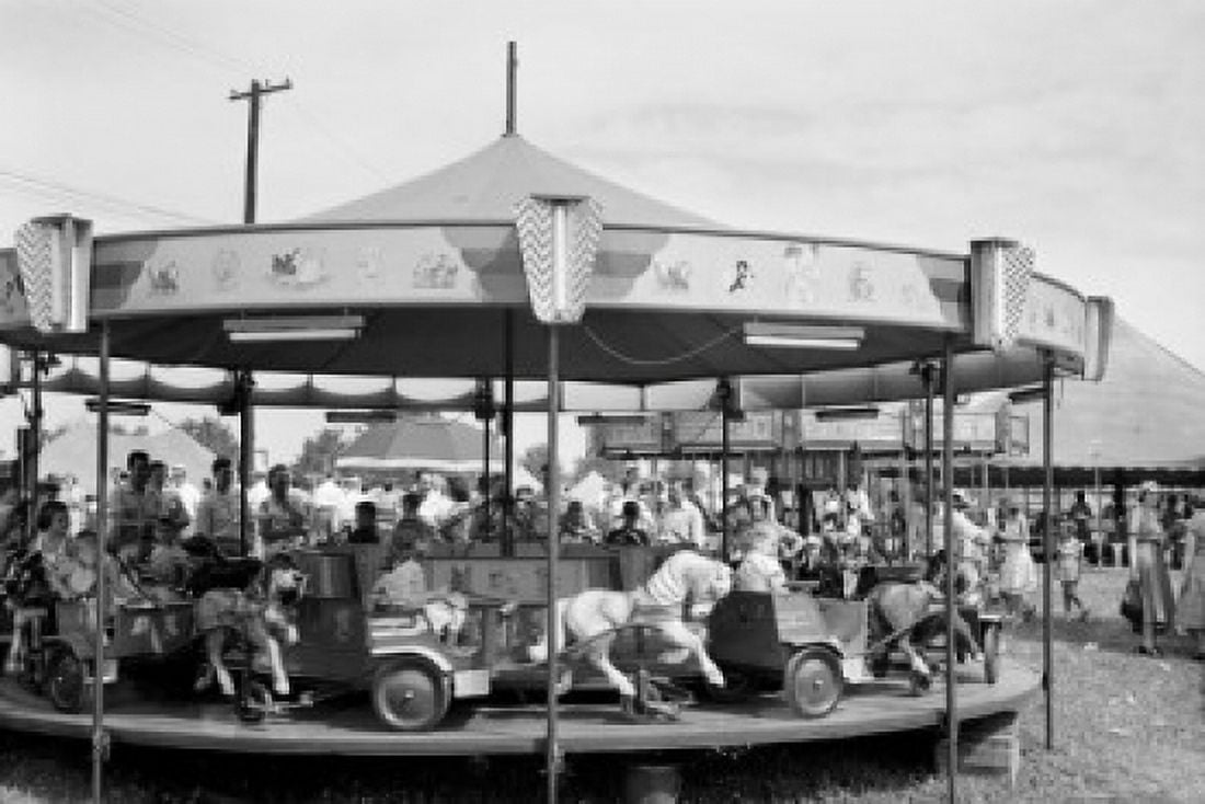 USA Pennsylvania Kutztow children on merry-go-round at fair grounds Canvas Art - (18 x 24)