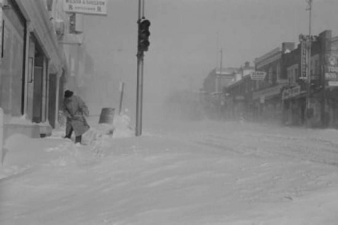 USA Pennsylvania Man digging snow from street Canvas Art - (18 x 24)