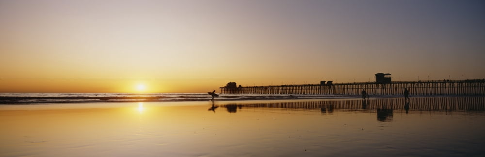 USA Reflections On Beach California Oceanside Pier And Surfers Silhouetted Against Sunset Canvas Art - Bill Schildge  Design Pics (29 x 9)