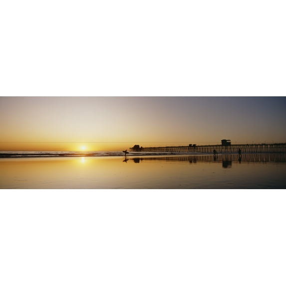 USA, Reflections On Beach; California, Oceanside Pier And Surfers Silhouetted Against Sunset Poster Print (36 x 12)