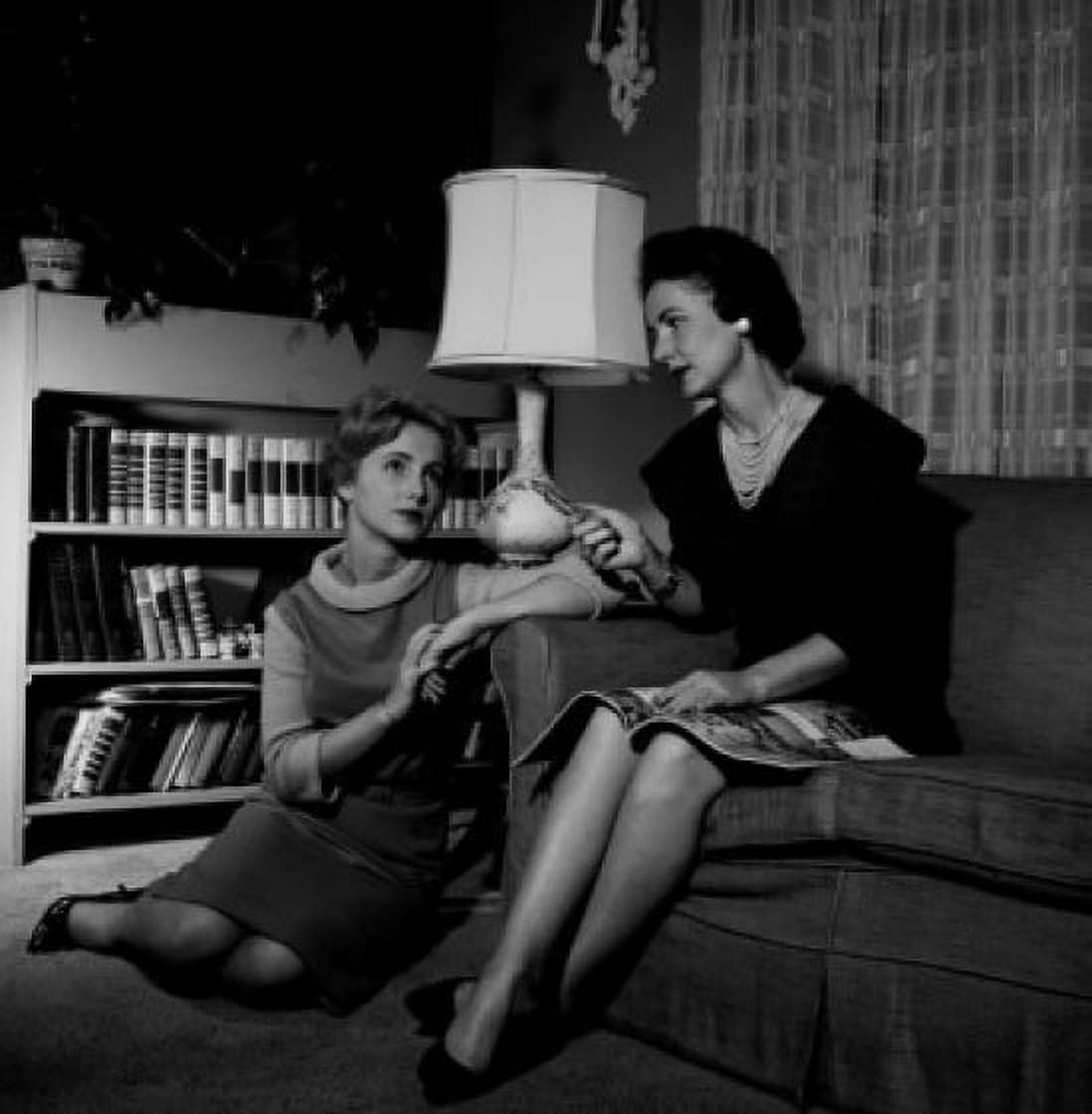 USA Two young women sitting in living room Canvas Art - (24 x 36)