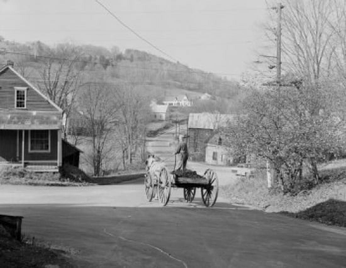 USA Vermont East Topshon Farmer driving wagon through town Canvas Art - (24 x 36)