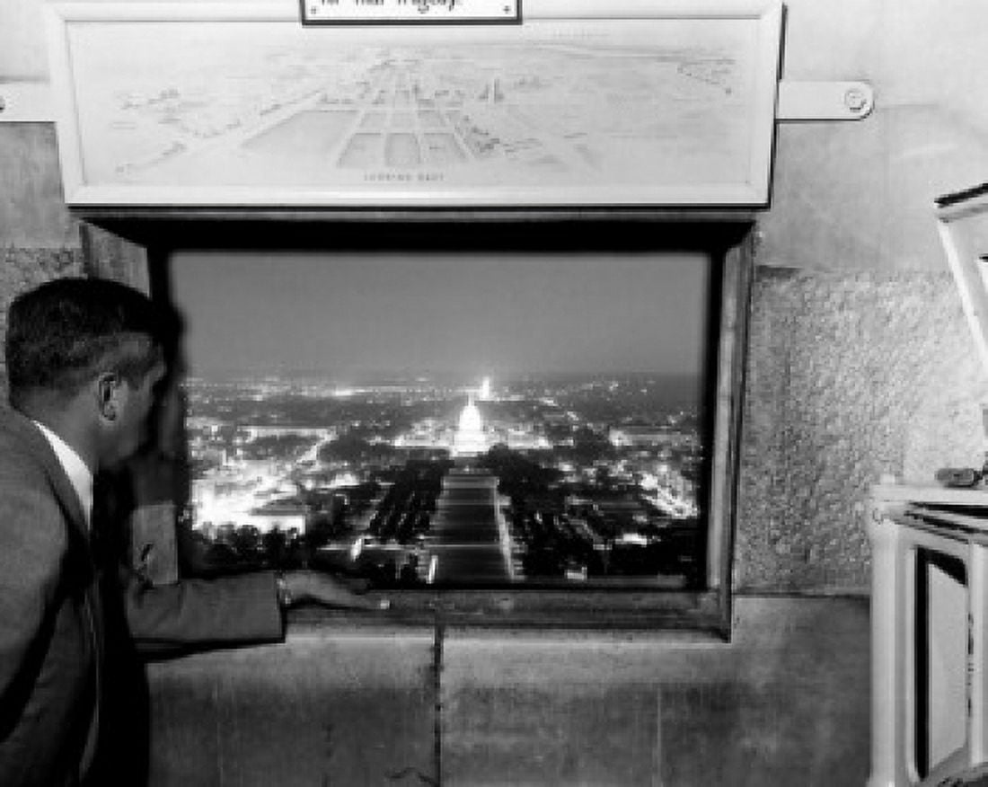 USA Washington DC man looking out of window from top of Washington Monument Canvas Art - (18 x 24)