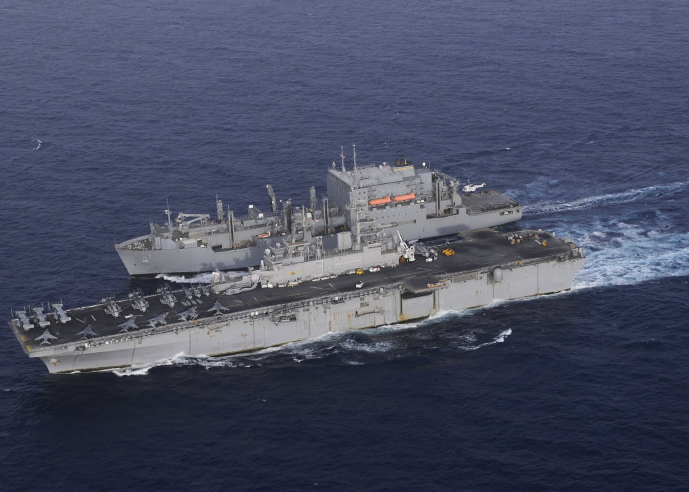 USS Kearsarge pulls alongside USNS Lewis and Clark for a replenishment at sea Canvas Art - Stocktrek Images (34 x 24)
