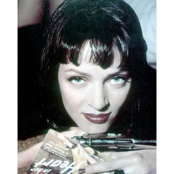 Uma Thurman holds pistol and pulp magazine in pose for Pulp Fiction 8x10 photo
