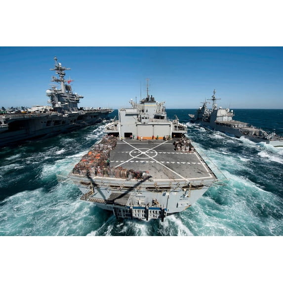 Underway replenishment at sea with US Navy ships in the Arabian Gulf Poster Print by Stocktrek Images (34 x 22)