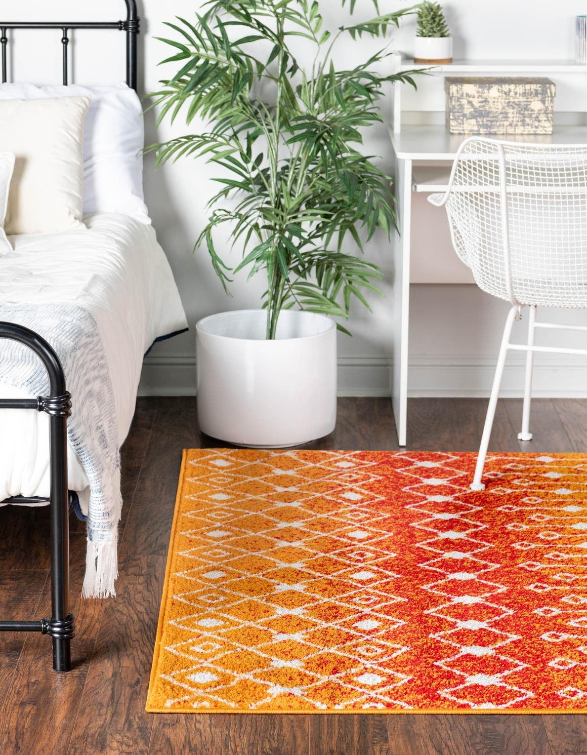 6' x 9' Orange and Red Synthetic Trellis Area Rug