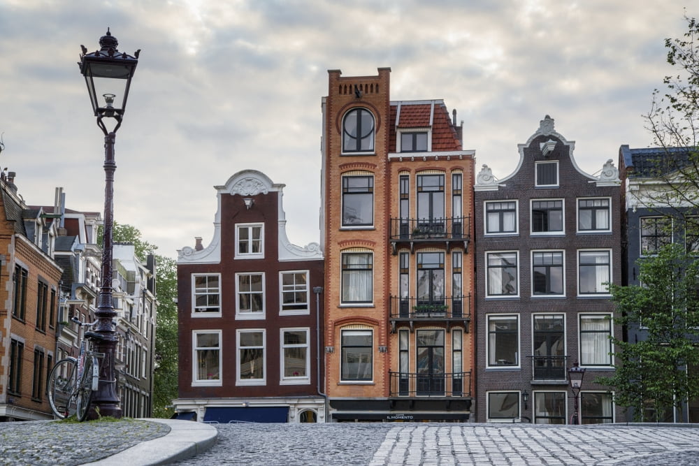 Unique residential buildings and a lamp post Amsterdam Netherlands Canvas Art - John Short Design Pics (38 x 24)