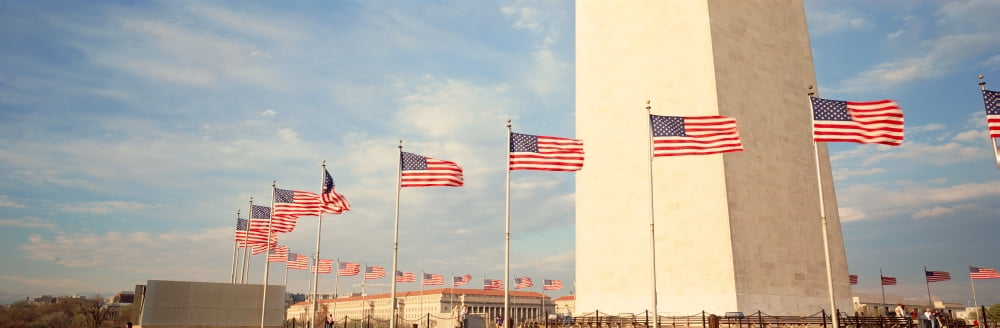 United States Flags at the base of Washington Memorial in Washington DC Canvas Art - Panoramic Images (27 x 9)