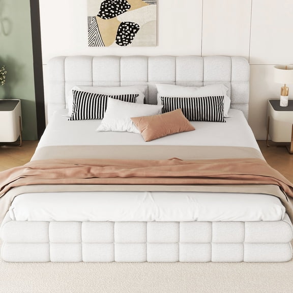 Upholstered, white queen bed with slat support | Keeps mattresses fresh and doesn't require a box spring in the bedroom