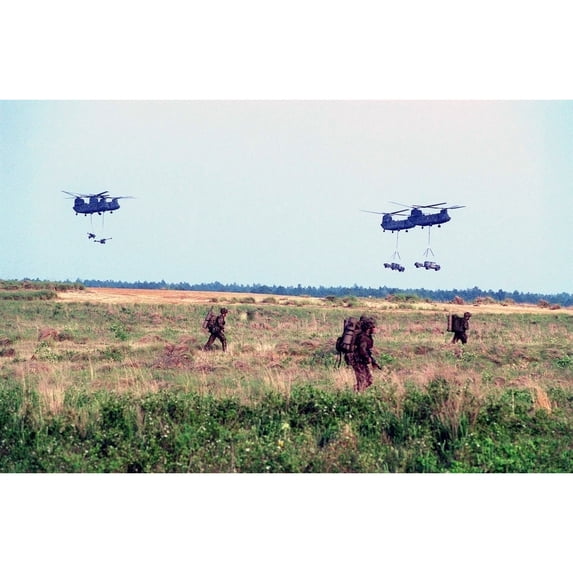 Us Army Chinook Ch-47'S Ferry In British Land Rovers During The Helicopter Insertion In Exercise With British Royal