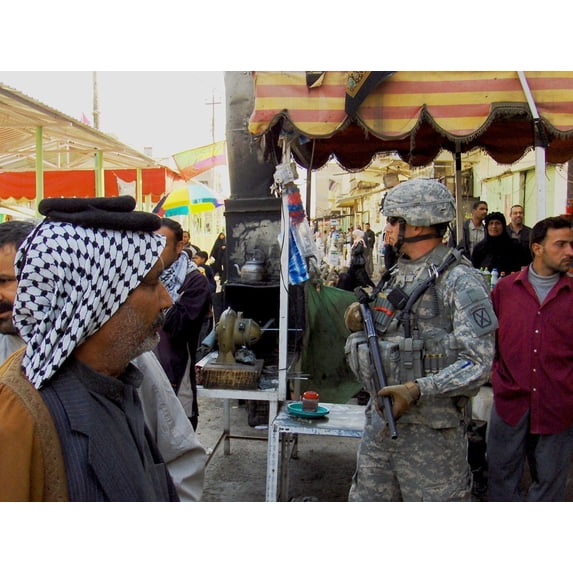 Us Soldier Patrols The Streets Of Martyrs Market As Local Nationals Shop In Mahmudiyah Iraq A Sunni Iraqi City South Of Baghdad Which Was A Center Of Insurgency During The Occupation Of Iraq. March 13