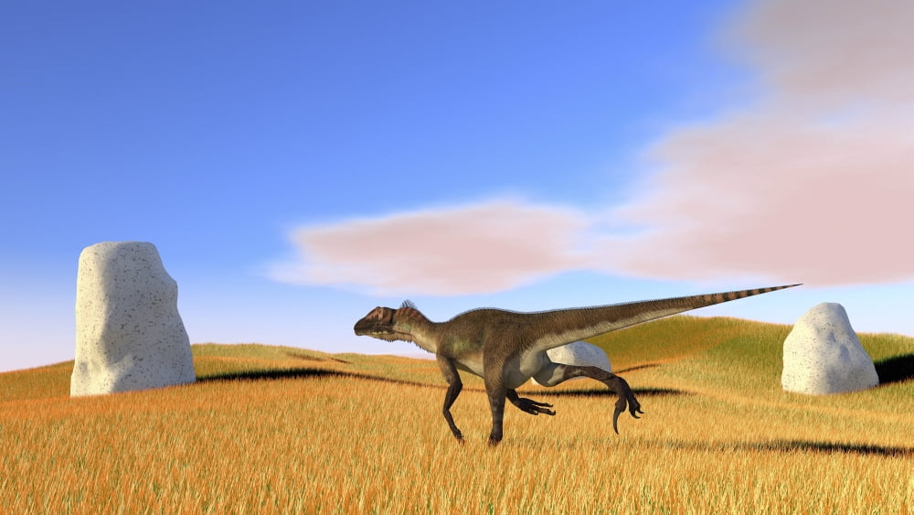 Utahraptor running across a grassy field Canvas Art - Kostyantyn IvanyshenStocktrek Images (38 x 22)